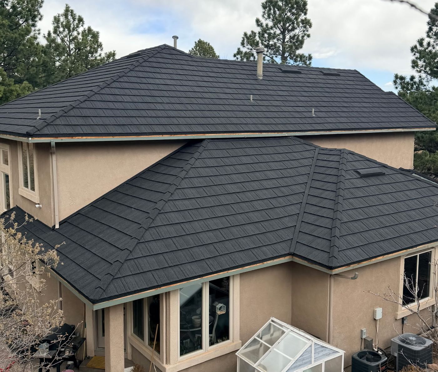 Two-story home with a WeatherLok stone-coated steel roof